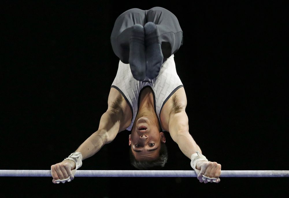 Iowa's Andrew Herrador competes in the parallel bars during the second day of the Big Ten Men's Gymnastics Championships at Carver-Hawkeye Arena in Iowa City on Saturday, Apr. 6, 2019. (Stephen Mally/hawkeyesports.com)