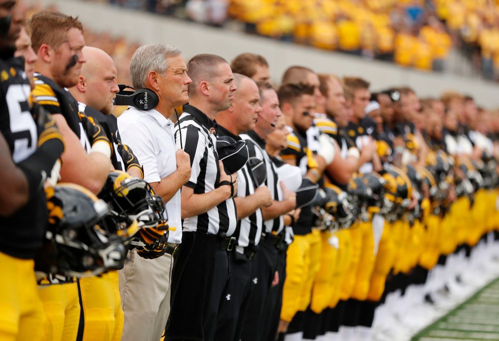 Iowa Hawkeyes head coach Kirk Ferentz stands for the National Anthem against the Northern Illinois Huskies Saturday, September 1, 2018 at Kinnick Stadium. (Brian Ray/hawkeyesports.com)