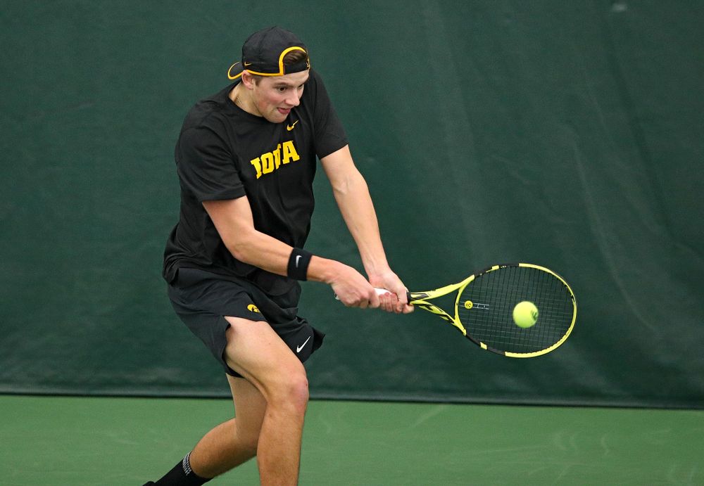 Iowa’s Joe Tyler returns a shot during their match at the Hawkeye Tennis and Recreation Complex in Iowa City on Thursday, January 16, 2020. (Stephen Mally/hawkeyesports.com)