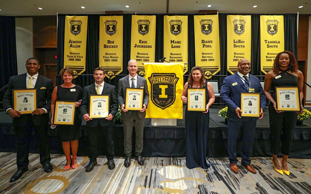 2019 University of Iowa Athletics Hall of Fame inductees Jeremy Allen (from left), Deb Brickey, Eric Juergens, Marc Long, Diane Pohl, LeRoy Smith, and Tangela Smith after the Hall of Fame Induction Ceremony at the Coralville Marriott Hotel and Conference Center in Coralville on Friday, Aug 30, 2019. (Stephen Mally/hawkeyesports.com)