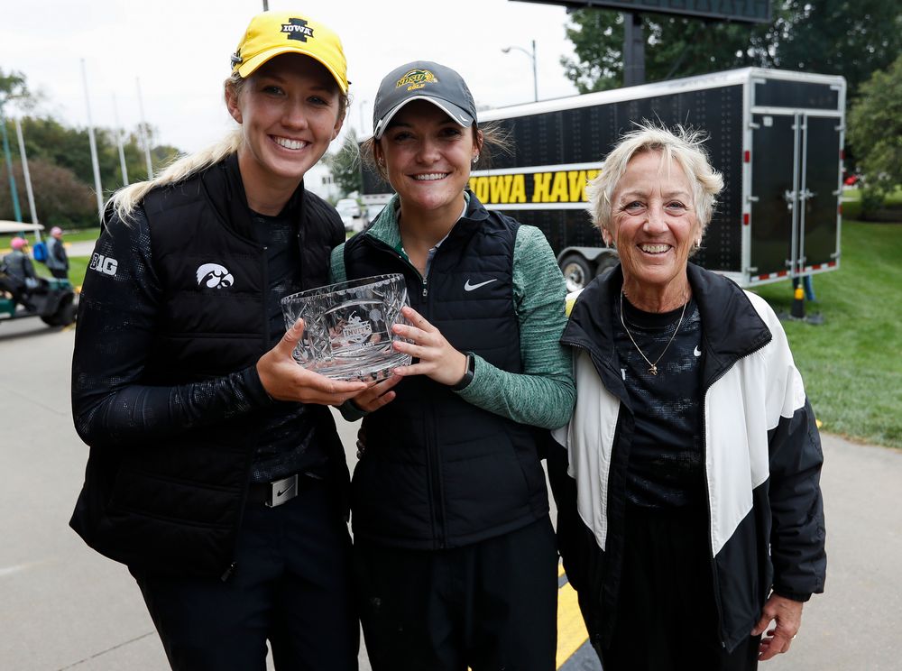 Iowa's Shawn Rennegarbe and North Dakota State's Taylor McCorkle, co-champions of the Diane Thomason Invitational, pose for a photo with former Iowa women's golf head coach Diane Thomason during a post-round awards ceremony after the final round of the Diane Thomason Invitational at Finkbine Golf Course on September 30, 2018. (Tork Mason/hawkeyesports.com)