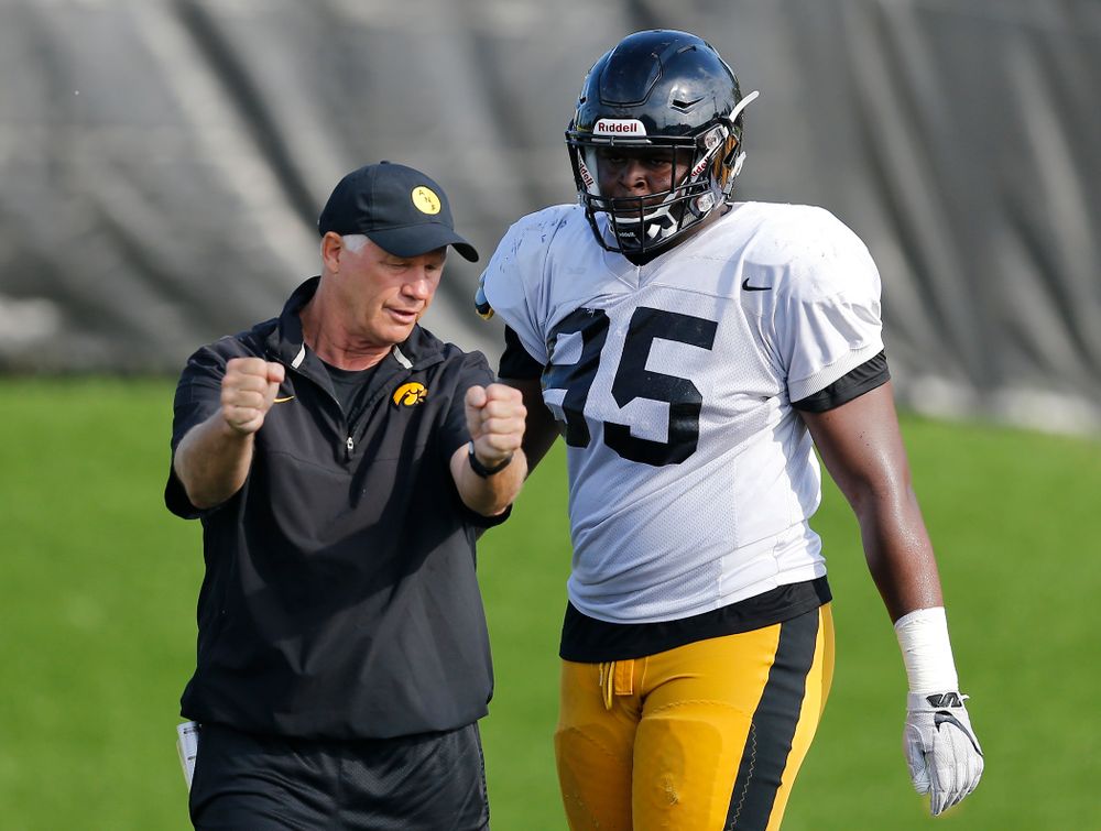 Iowa Hawkeyes defensive line coach Reese Morgan works with defensive end Cedrick Lattimore (95) Wednesday, August 17, 2016 at the Hansen Football Performance Center. (Brian Ray/hawkeyesports.com)