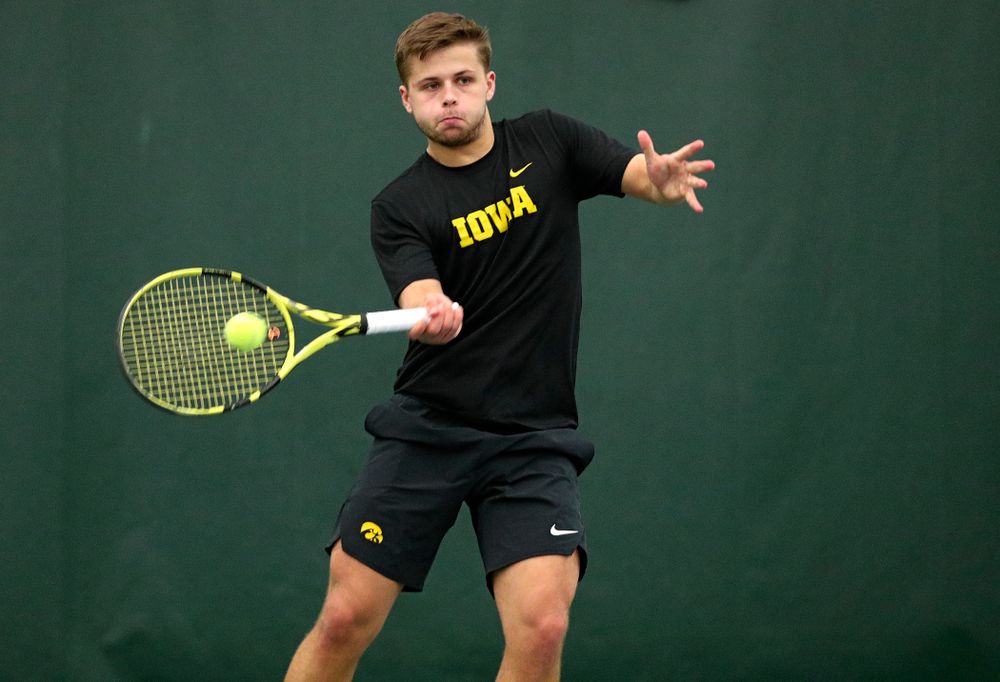 Iowa’s Will Davies returns a shot during his singles match at the Hawkeye Tennis and Recreation Complex in Iowa City on Friday, February 14, 2020. (Stephen Mally/hawkeyesports.com)