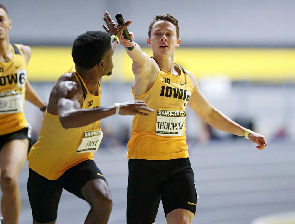 Iowa’s Christ Thompson (right) hands the baton off to DeJuan Frye as they run the men’s 1600 meter relay event during the Hawkeye Invitational at the Recreation Building in Iowa City on Saturday, January 11, 2020. (Stephen Mally/hawkeyesports.com)