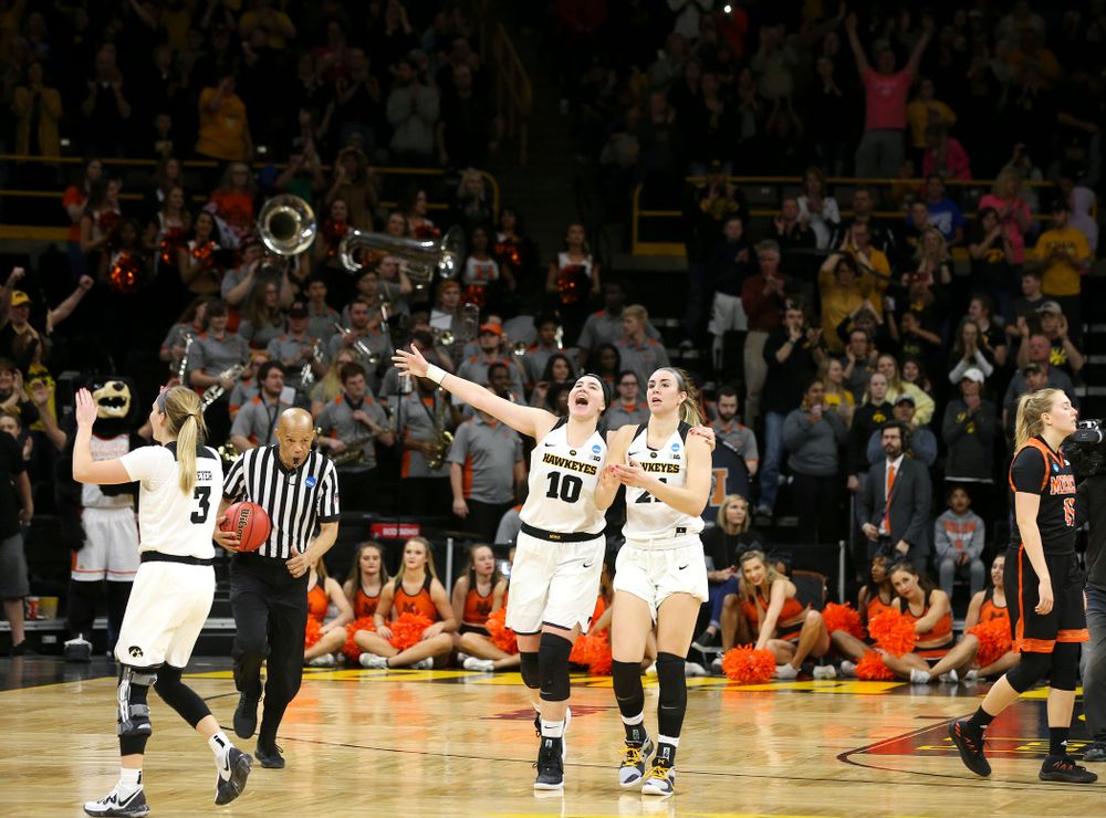 Iowa Hawkeyes guard Makenzie Meyer (3), forward Megan Gustafson (10), and forward Hannah Stewart (21) after winning their game during the first round of the 2019 NCAA Women's Basketball Tournament at Carver Hawkeye Arena in Iowa City on Friday, Mar. 22, 2019. (Stephen Mally for hawkeyesports.com)