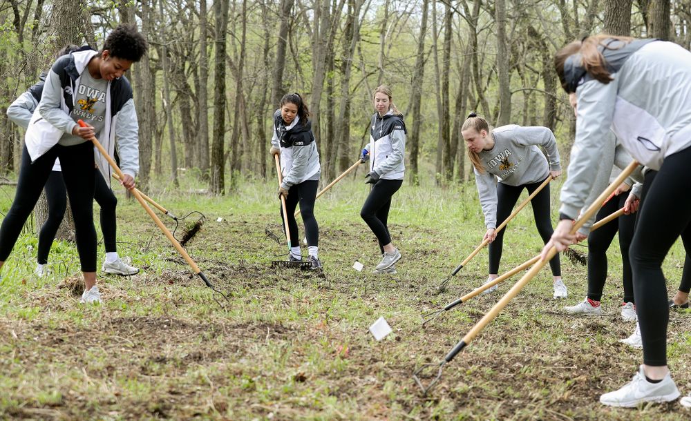 Iowa women's volleyball players prepare the ground for the Woodpecker single track during the 21st annual ISAAC Hawkeye Day of Caring in Coralville on Sunday, Apr. 28, 2019. (Stephen Mally/hawkeyesports.com)