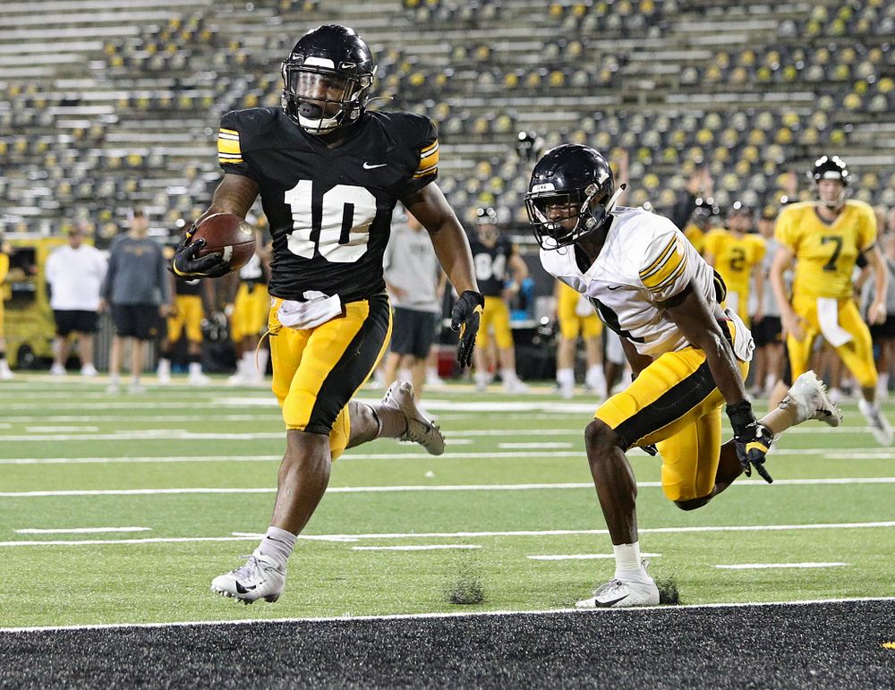 Iowa Hawkeyes running back Mekhi Sargent (10) gets around defensive back Matt Hankins (8) and scores a touchdown during Fall Camp Practice No. 12 at Kinnick Stadium in Iowa City on Thursday, Aug 15, 2019. (Stephen Mally/hawkeyesports.com)