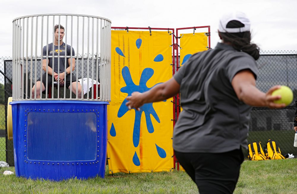 Iowa assistant strength and conditioning coach Cody Roberts sits in the dunk tank during the Student-Athlete Kickoff outside the Karro Athletics Hall of Fame Building in Iowa City on Sunday, Aug 25, 2019. (Stephen Mally/hawkeyesports.com)
