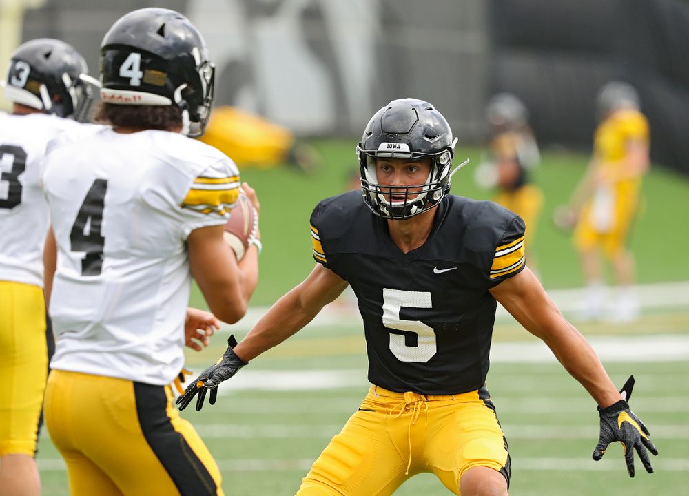 Iowa Hawkeyes wide receiver Oliver Martin (5) eyes defensive back Dane Belton (4) as they run a drill during Fall Camp Practice No. 10 at the Hansen Football Performance Center in Iowa City on Tuesday, Aug 13, 2019. (Stephen Mally/hawkeyesports.com)