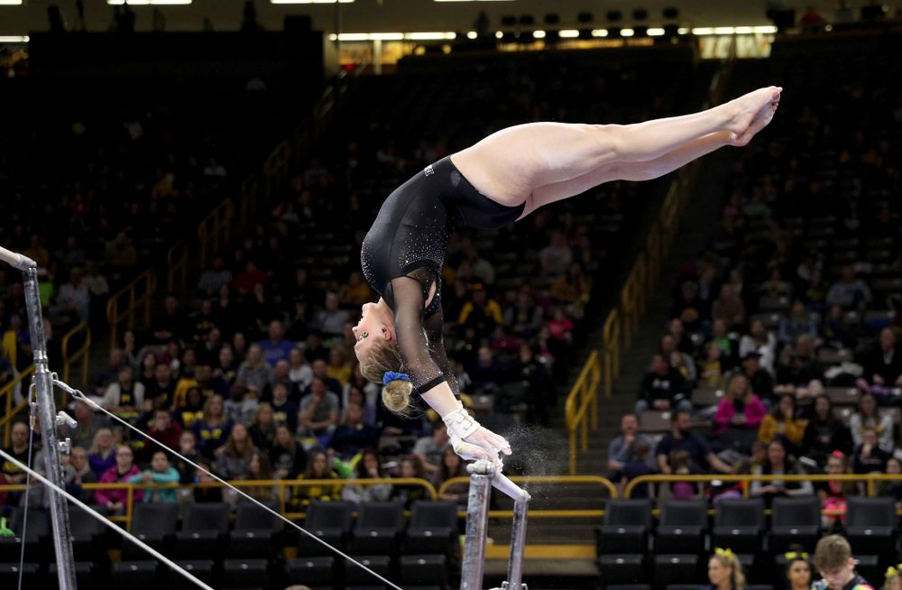 Iowa’s Elinor Rogers competes on the bars against Michigan Friday, February 14, 2020 at Carver-Hawkeye Arena. (Brian Ray/hawkeyesports.com)