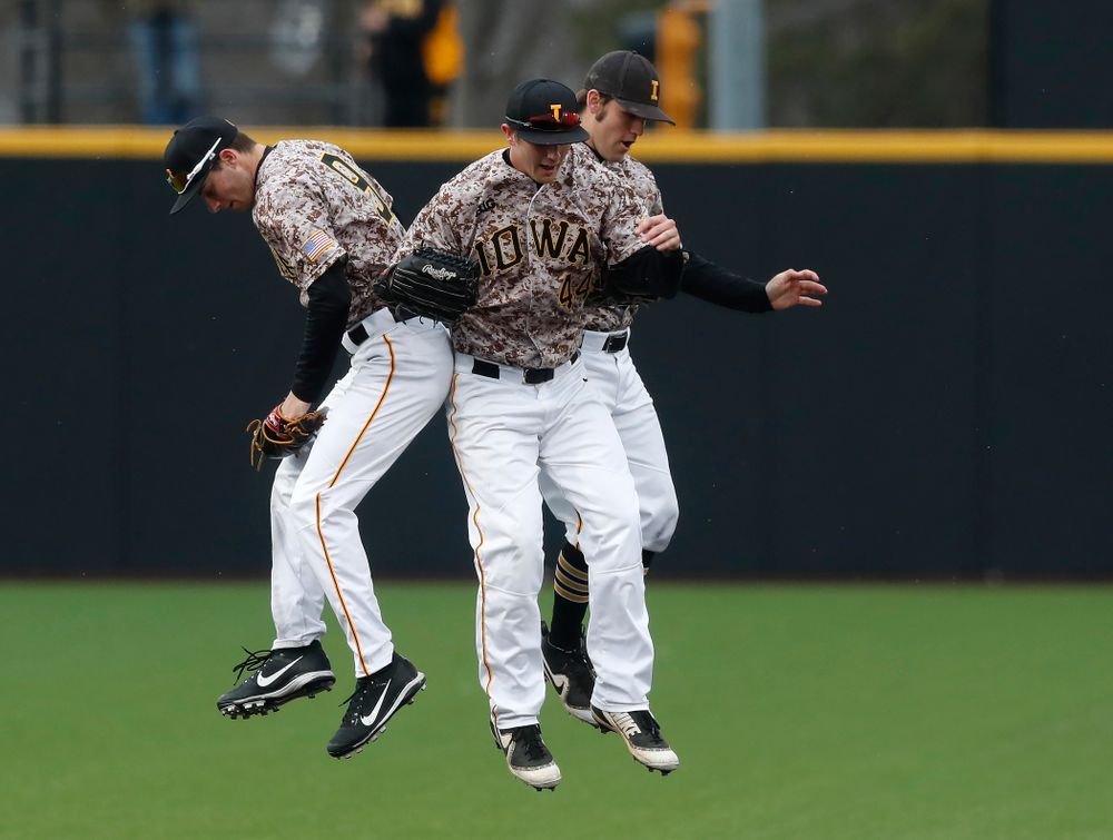Iowa Hawkeyes outfielder Ben Norman (9), outfielder Robert Neustrom (44), and outfielder Justin Jenkins (6) during a double header against the Indiana Hoosiers Friday, March 23, 2018 at Duane Banks Field. (Brian Ray/hawkeyesports.com)