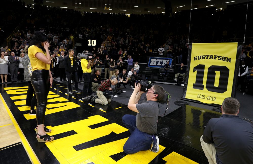 Megan Gustafson wipes away a tear as her number is raised into the rafters during a jersey retirement ceremony Sunday, January 26, 2020 at Carver-Hawkeye Arena. (Brian Ray/hawkeyesports.com)