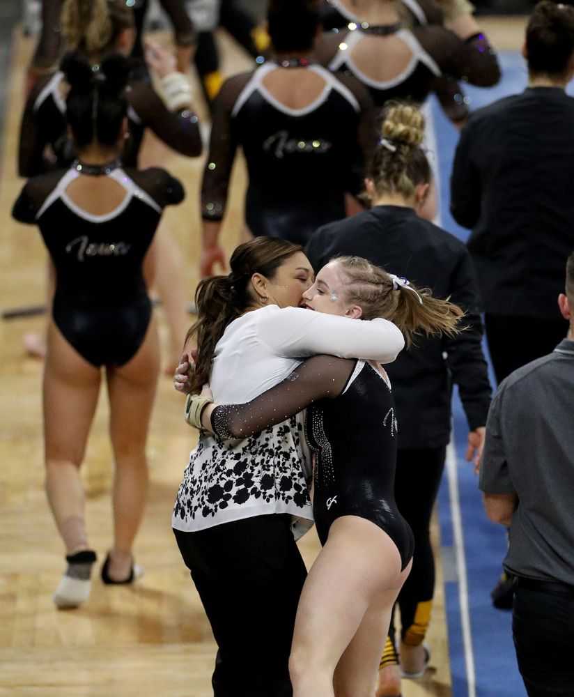 Iowa’s Head Coach Larissa Libby hugs Lauren Guerin after her performance on the vault against Michigan State Saturday, February 1, 2020 at Carver-Hawkeye Arena. (Brian Ray/hawkeyesports.com)