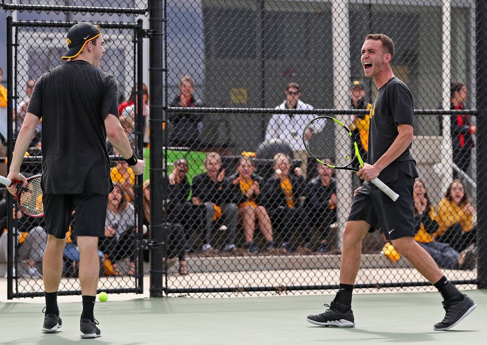 Iowa's Kareem Allaf (right) and Jonas Larsen celebrate a score during a double match against Ohio State at the Hawkeye Tennis and Recreation Complex in Iowa City on Sunday, Apr. 7, 2019. (Stephen Mally/hawkeyesports.com)