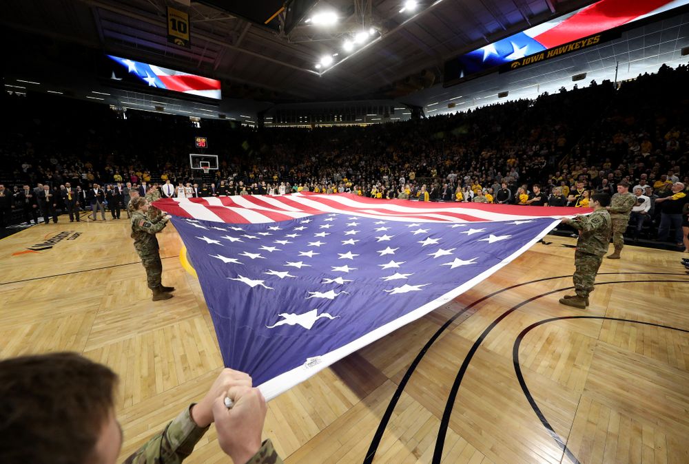 Members of the Iowa Army ROTC display a large American flag before the Iowa Hawkeyes game against Penn State Saturday, February 29, 2020 at Carver-Hawkeye Arena. (Brian Ray/hawkeyesports.com)