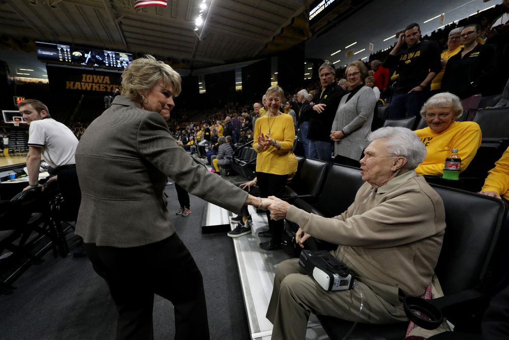 Iowa Hawkeyes head coach Lisa Bluder shakes hands with women's athletic director Dr. Christine Grant before their game against Penn State Saturday, February 22, 2020 at Carver-Hawkeye Arena. (Brian Ray/hawkeyesports.com)