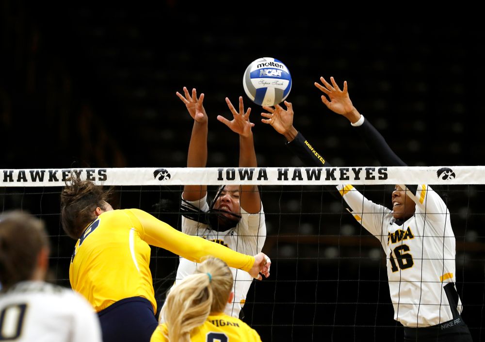 Iowa Hawkeyes middle blocker Amiya Jones (9) and outside hitter Taylor Louis (16) against the Michigan Wolverines Sunday, September 23, 2018 at Carver-Hawkeye Arena. (Brian Ray/hawkeyesports.com)