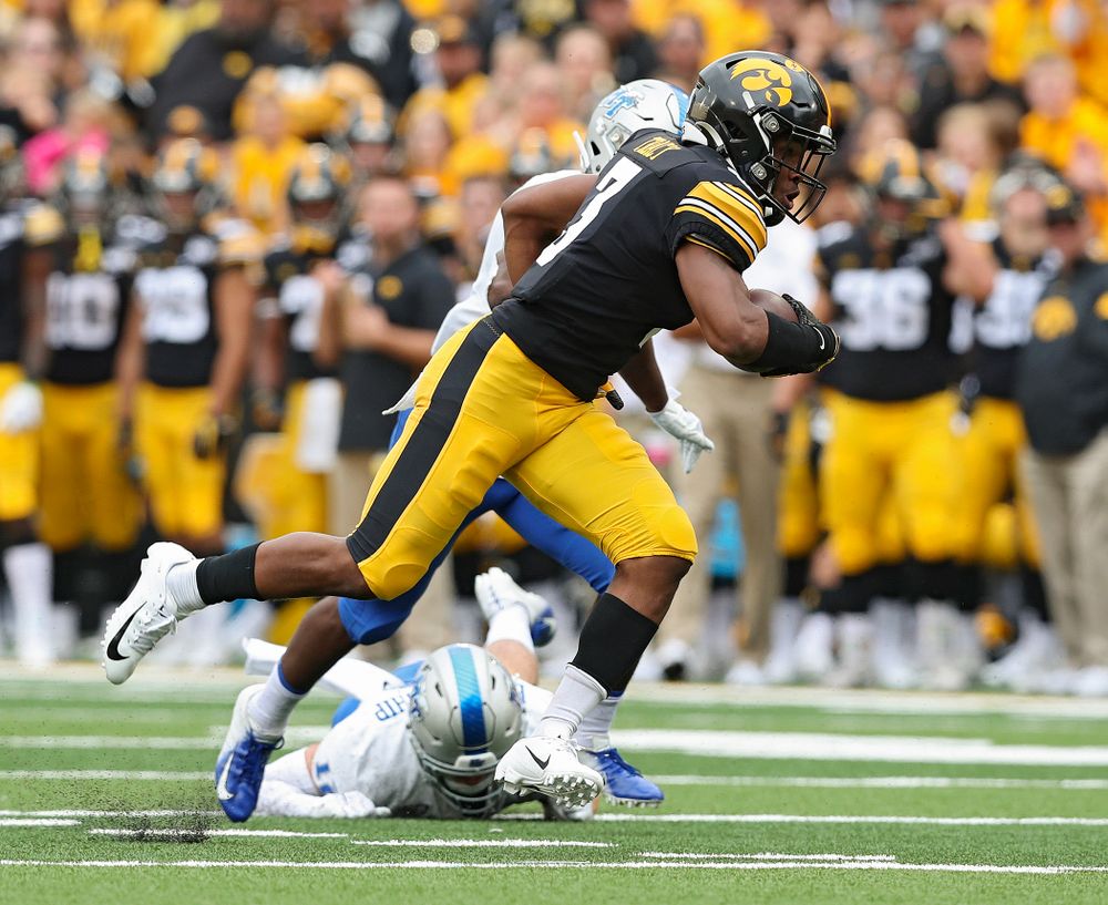 Iowa Hawkeyes wide receiver Tyrone Tracy Jr. (3) spins away from a defender after pulling in a pass during third quarter of their game at Kinnick Stadium in Iowa City on Saturday, Sep 28, 2019. (Stephen Mally/hawkeyesports.com)
