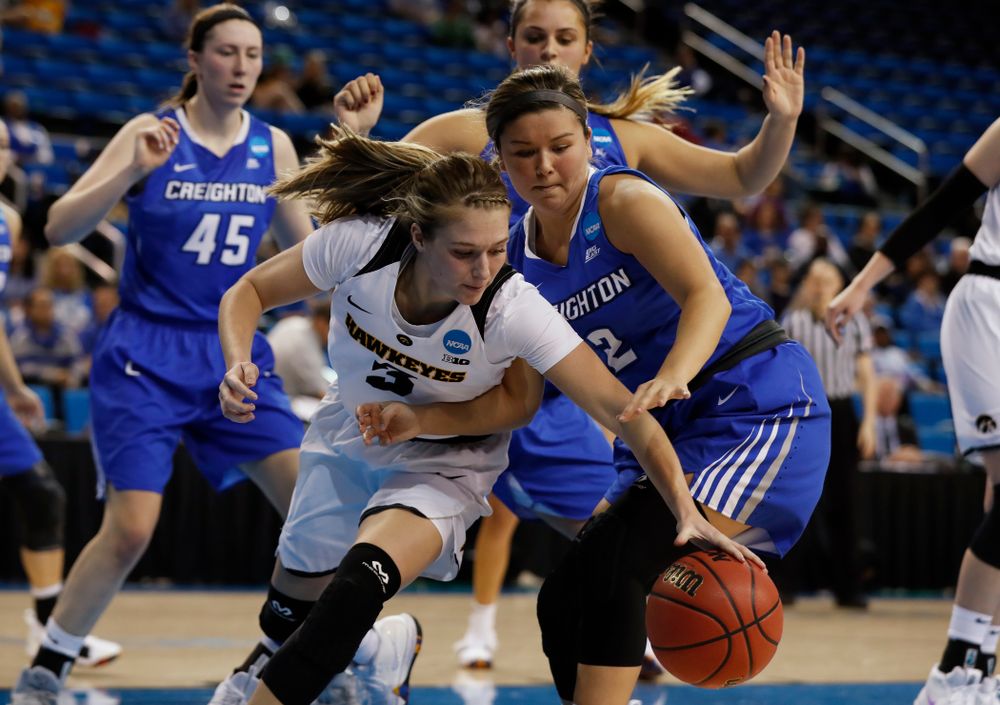 Iowa Hawkeyes guard Makenzie Meyer (3) battles for a loose ball against the Creighton Bluejays Myah Mellman (2) in the first round of the 2018 NCAA Women's Basketball Tournament Saturday, March 17, 2018 at Pauley Pavilion on the campus of UCLA. (Brian Ray/hawkeyesports.com)