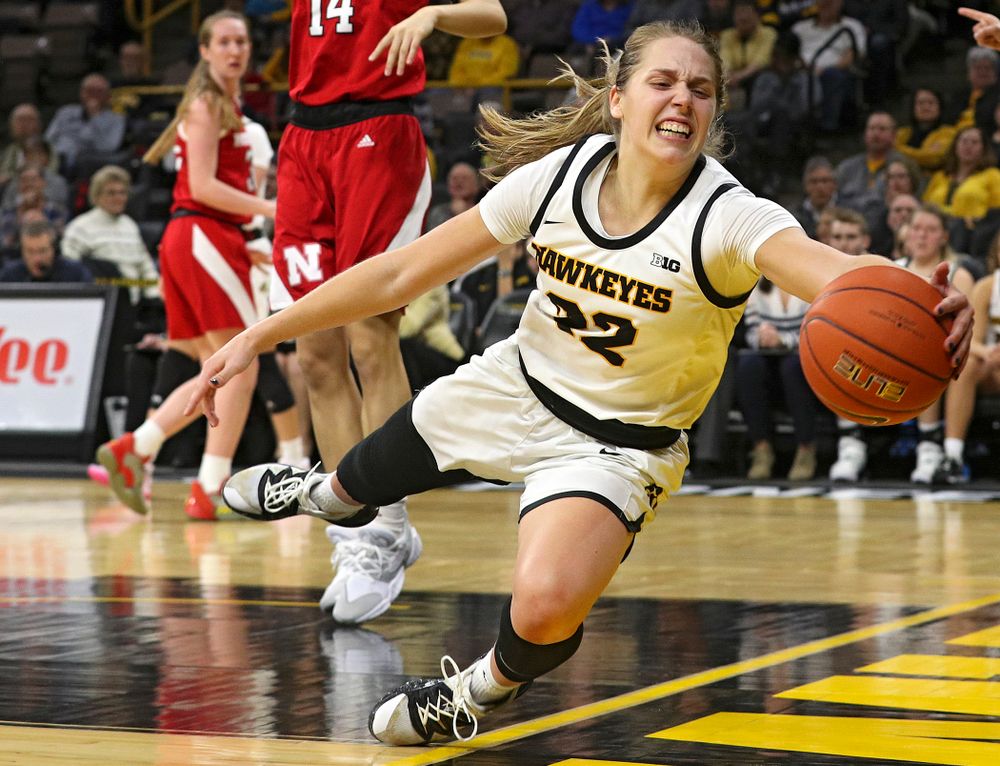 Iowa Hawkeyes guard Kathleen Doyle (22) tries to save the ball from going out of bounds during the fourth quarter of the game at Carver-Hawkeye Arena in Iowa City on Thursday, February 6, 2020. (Stephen Mally/hawkeyesports.com)