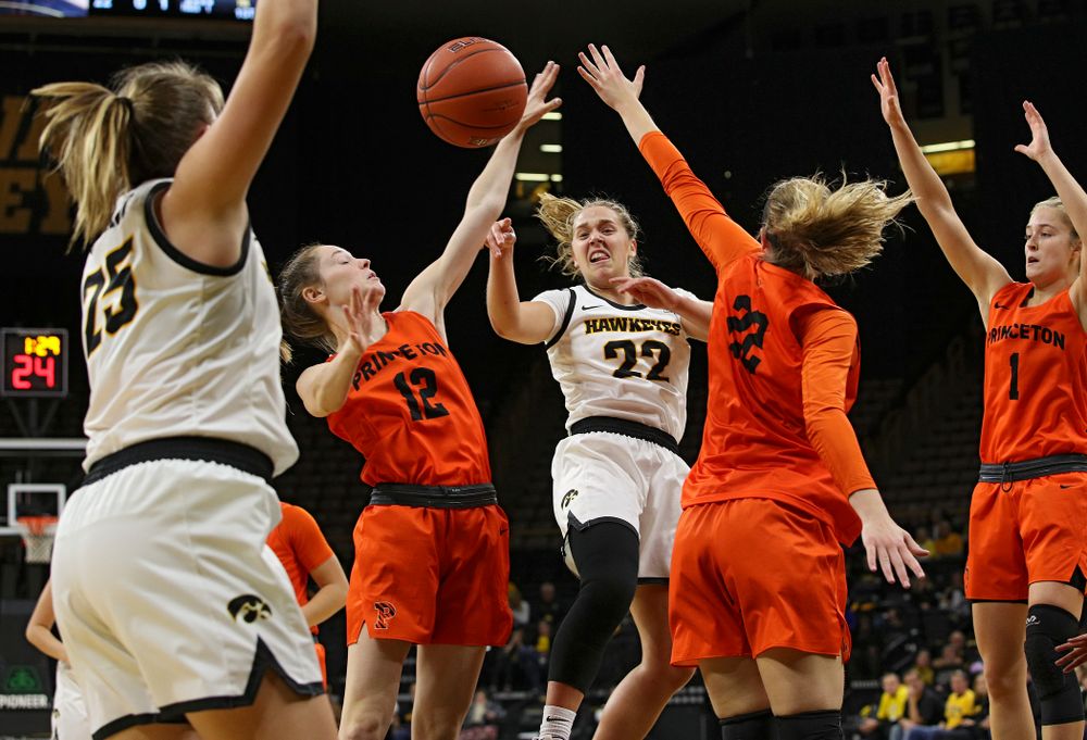 Iowa guard Kathleen Doyle (22) passes the ball to forward/center Monika Czinano (25) who scores during the first quarter of their overtime win against Princeton at Carver-Hawkeye Arena in Iowa City on Wednesday, Nov 20, 2019. (Stephen Mally/hawkeyesports.com)