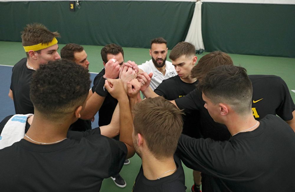 The Hawkeyes huddle before their match at the Hawkeye Tennis and Recreation Complex in Iowa City on Thursday, January 16, 2020. (Stephen Mally/hawkeyesports.com)