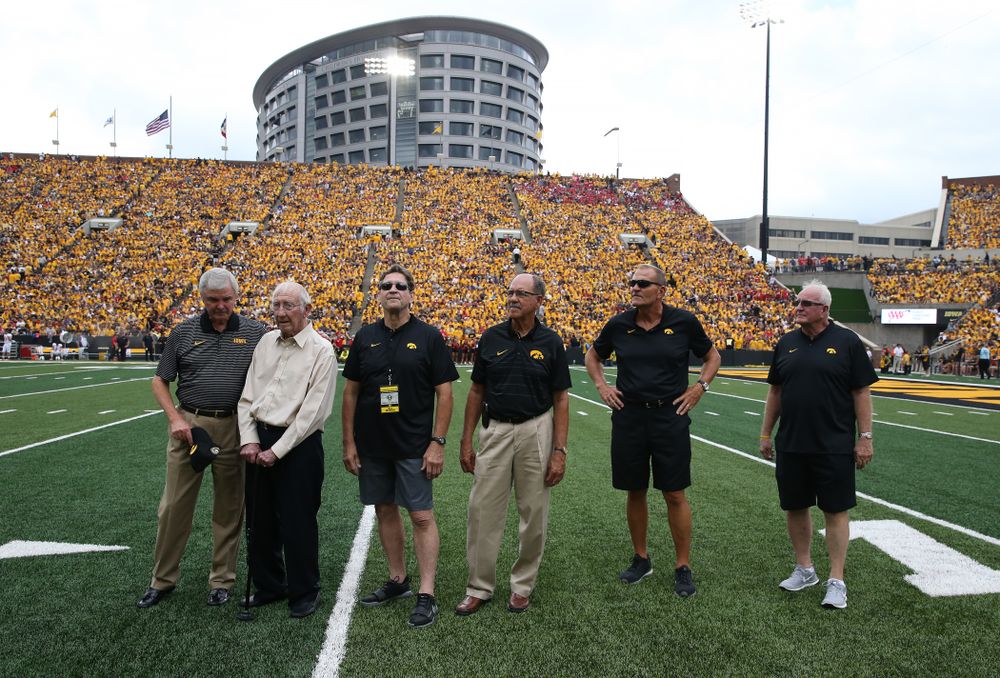 The 1983 Coaching Staff on the field against the Northern Illinois Huskies Saturday, September 1, 2018 at Kinnick Stadium. (Brian Ray/hawkeyesports.com)