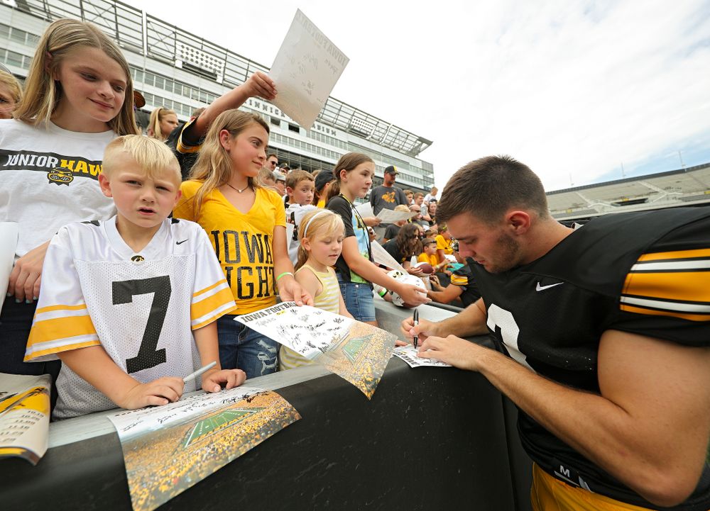 Iowa Hawkeyes place kicker Keith Duncan (3) signs an autograph during Kids Day at Kinnick Stadium in Iowa City on Saturday, Aug 10, 2019. (Stephen Mally/hawkeyesports.com)