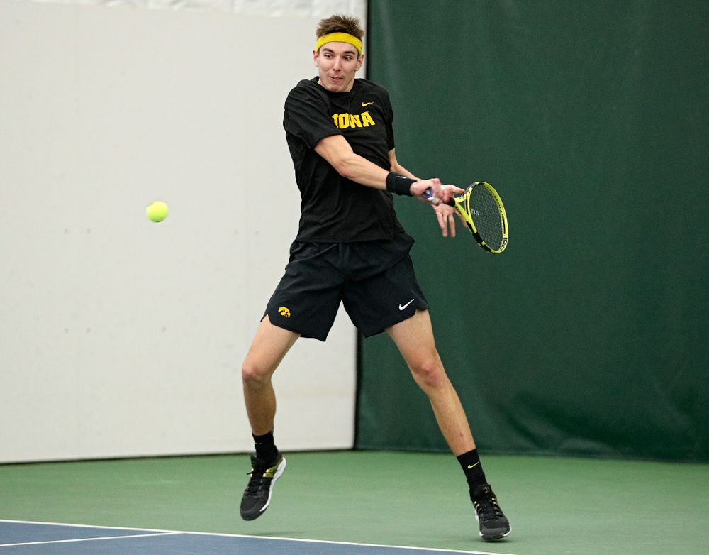 Iowa’s Nikita Snezhko returns a shot during his doubles match at the Hawkeye Tennis and Recreation Complex in Iowa City on Thursday, January 16, 2020. (Stephen Mally/hawkeyesports.com)