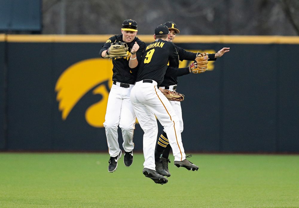 Iowa outfielders Zeb Adreon (5), Ben Norman (9), and Justin Jenkins (6) celebrate after winning their college baseball game at Duane Banks Field in Iowa City on Tuesday, March 10, 2020. (Stephen Mally/hawkeyesports.com)