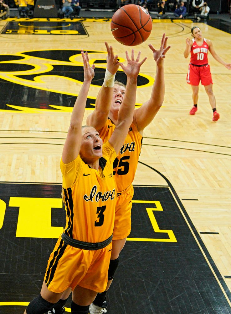 Iowa Hawkeyes guard Makenzie Meyer (3) and forward Monika Czinano (25) prepare to pull in a rebound during the third quarter of their game at Carver-Hawkeye Arena in Iowa City on Thursday, January 23, 2020. (Stephen Mally/hawkeyesports.com)