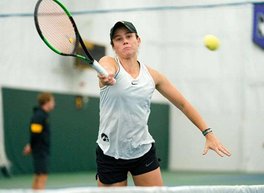 Iowa’s Elise Van Heuvelen reaches for a shot during her doubles match at the Hawkeye Tennis and Recreation Complex in Iowa City on Sunday, February 16, 2020. (Stephen Mally/hawkeyesports.com)
