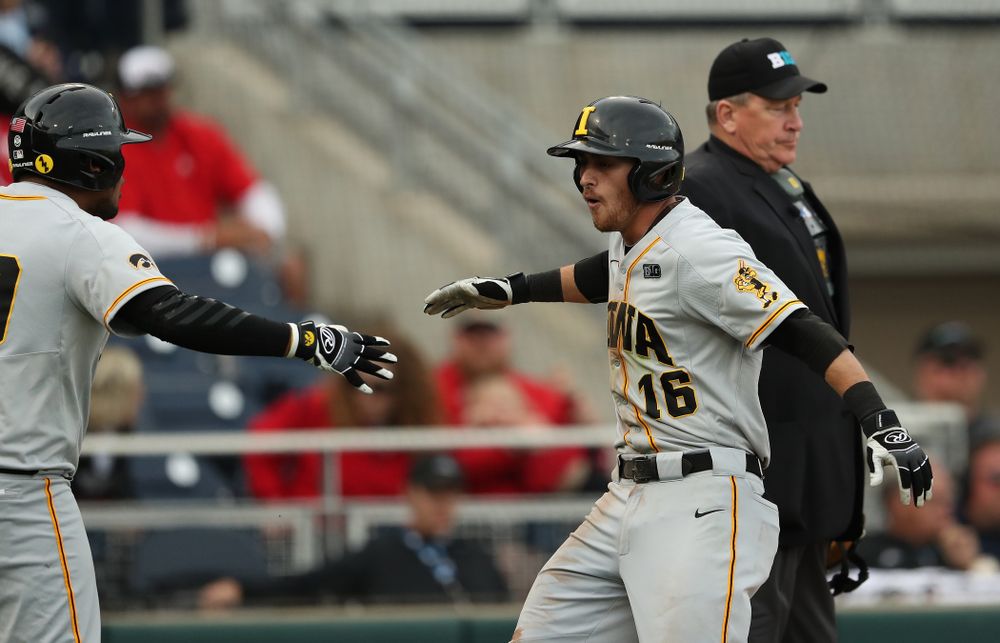 Iowa Hawkeyes Tanner Wetrich (16) scores against the Indiana Hoosiers in the first round of the Big Ten Baseball Tournament Wednesday, May 22, 2019 at TD Ameritrade Park in Omaha, Neb. (Brian Ray/hawkeyesports.com)