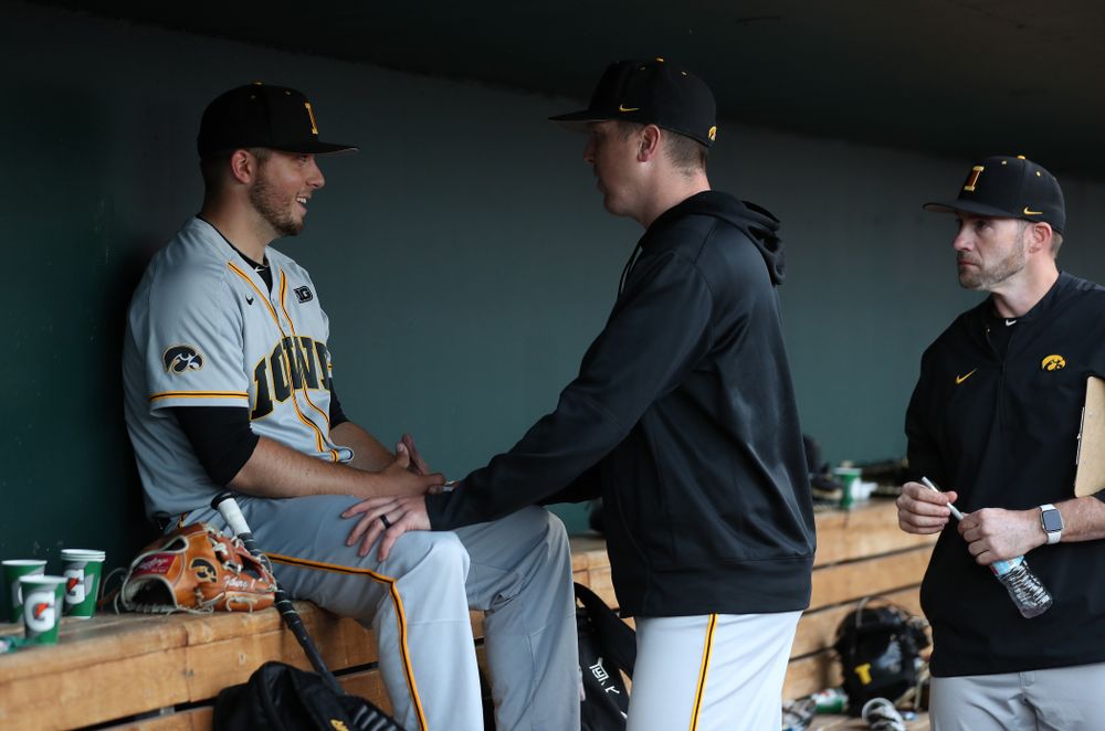 Iowa Hawkeyes Cole McDonald (11) talks with pitching coach Tom Gorzelanny against the Indiana Hoosiers in the first round of the Big Ten Baseball Tournament Wednesday, May 22, 2019 at TD Ameritrade Park in Omaha, Neb. (Brian Ray/hawkeyesports.com)