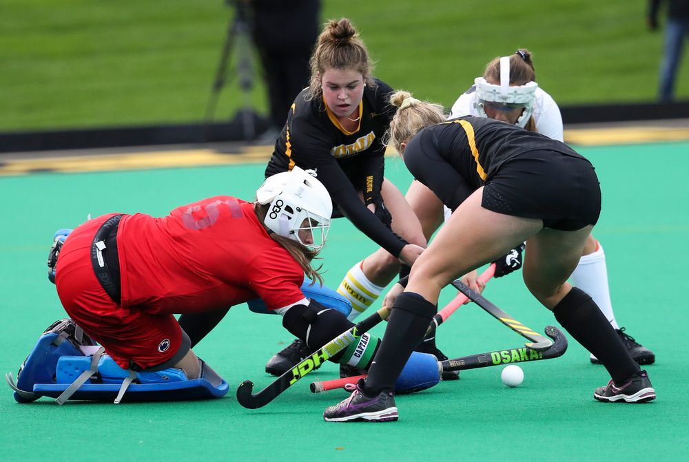 Iowa Hawkeyes midfielder Meghan Conroy (5) and Iowa Hawkeyes midfielder Makenna Grewe (4) scramble for a rebound during a game against No. 6 Penn State at Grant Field on October 12, 2018. (Tork Mason/hawkeyesports.com)