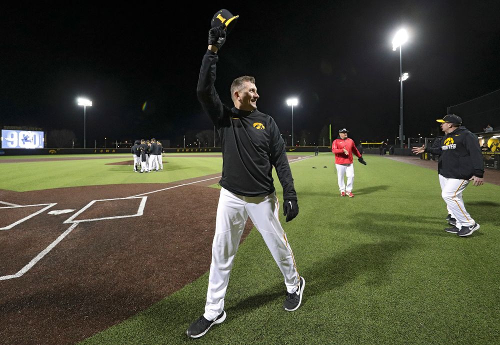 Iowa Hawkeyes head coach Rick Heller acknowledges the crowd after winning his 900th career game after their game at Duane Banks Field in Iowa City on Tuesday, March 3, 2020. (Stephen Mally/hawkeyesports.com)