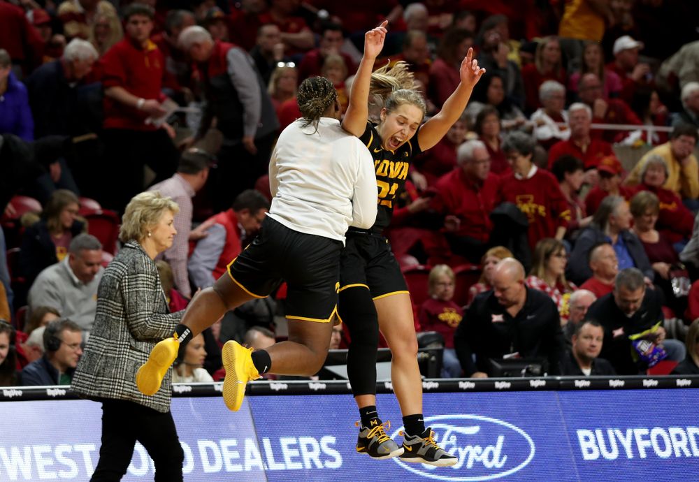 Iowa Hawkeyes guard Kathleen Doyle (22) celebrates with Iowa Hawkeyes guard Zion Sanders (21) at the end of the game against the Iowa State Cyclones Wednesday, December 11, 2019 at Hilton Coliseum in Ames, Iowa(Brian Ray/hawkeyesports.com)