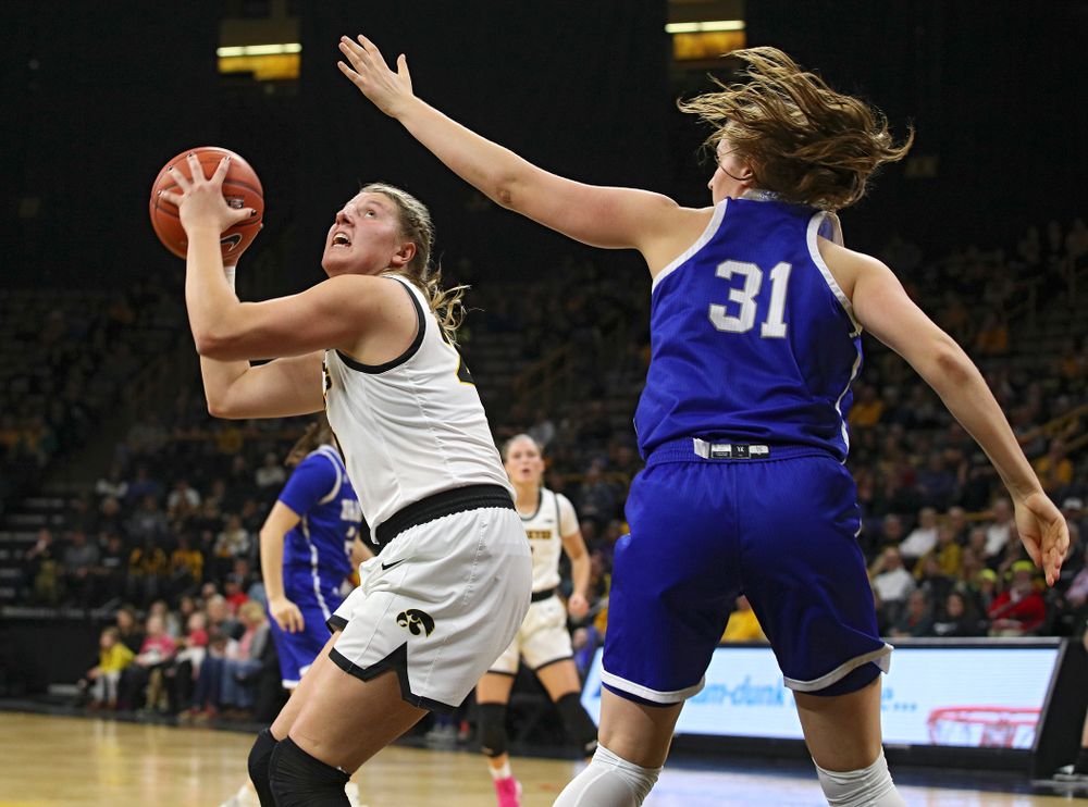 Iowa Hawkeyes forward Monika Czinano (25) eyes the basket before making a bucket during the second quarter of their game at Carver-Hawkeye Arena in Iowa City on Saturday, December 21, 2019. (Stephen Mally/hawkeyesports.com)
