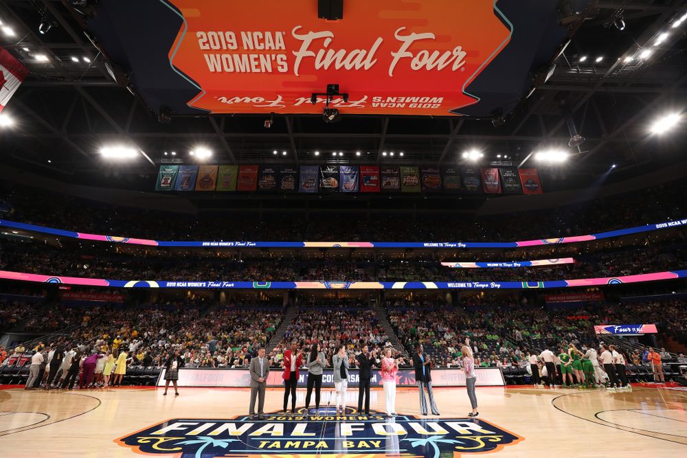 Iowa Hawkeyes forward Megan Gustafson (10) and Iowa State's Bridget Carleton are introduced with Naismith Starting 5 namesakes during a timeout in the second half of the National Semi-Final between Baylor and Oregon Friday, April 5, 2019 at Amalie Arena in Tampa, FL. (Brian Ray/hawkeyesports.com)