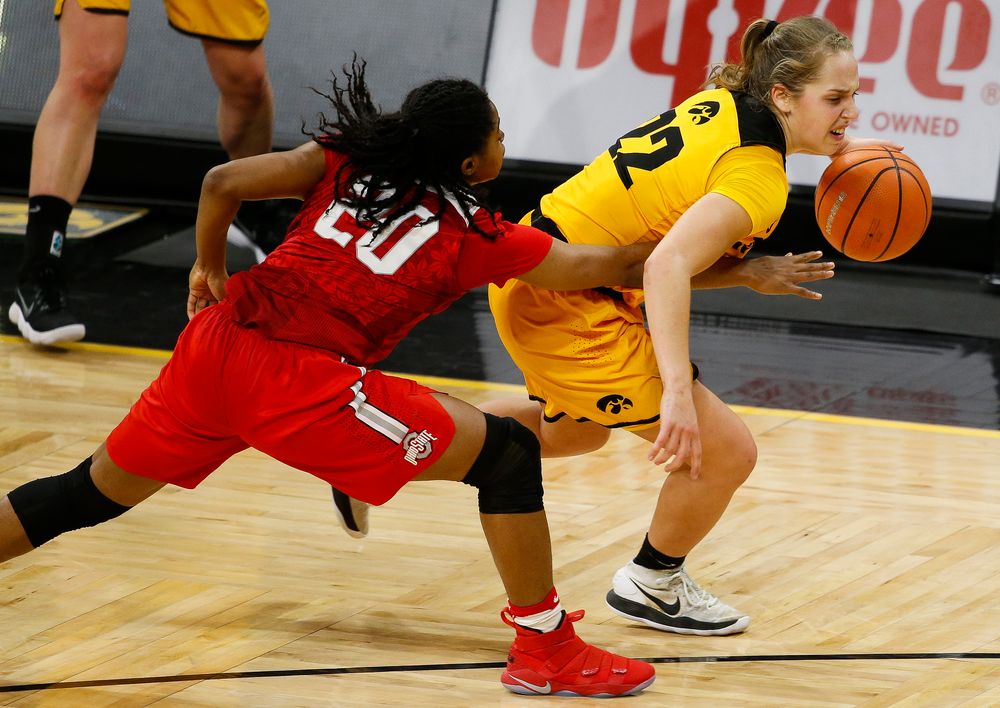 Iowa Hawkeyes guard Kathleen Doyle (22) is fouled during a game against the Ohio State Buckeyes at Carver-Hawkeye Arena on January 25, 2018. (Tork Mason/hawkeyesports.com)