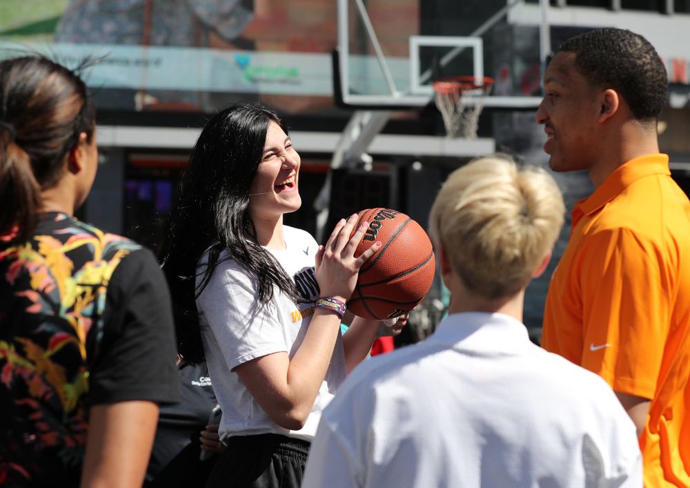 Iowa Hawkeyes forward Megan Gustafson (10) and TennesseeÕs Grant Williams during a Special Olympics event Friday, April 12, 2019 as part of the ESPN College Basketball Awards in the XBOX Plaza at LA Live.  (Brian Ray/hawkeyesports.com)