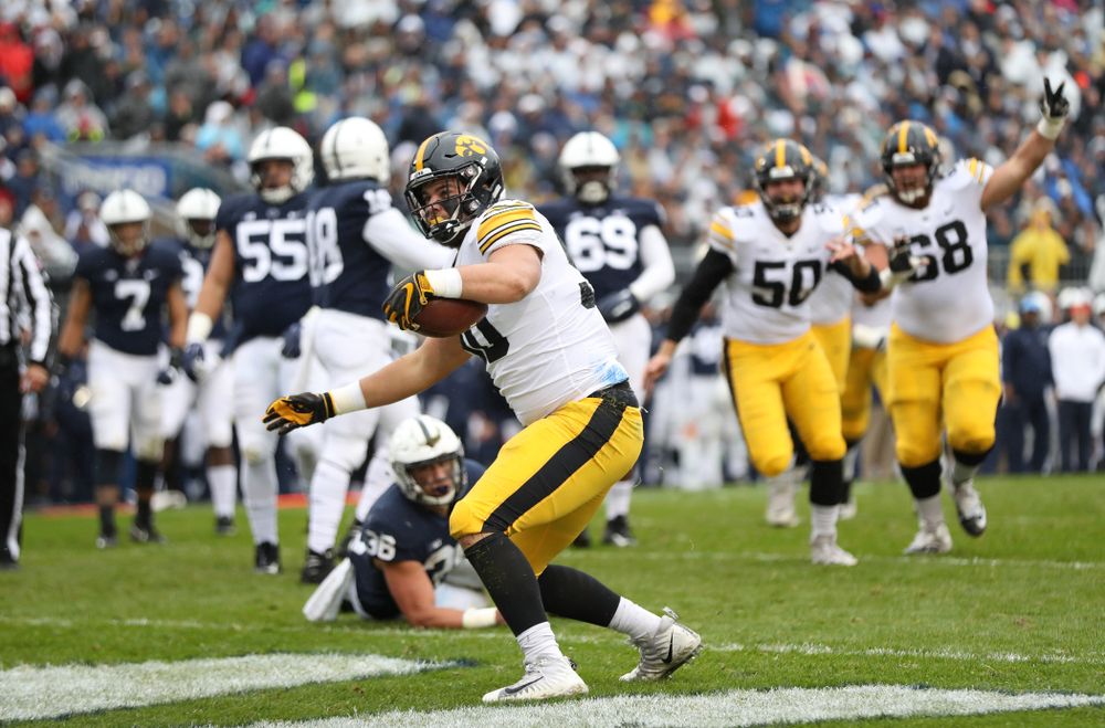 Iowa Hawkeyes defensive end Sam Brincks (90) catches a touchdown pass against the Penn State Nittany Lions Saturday, October 27, 2018 at Beaver Stadium in University Park, Pa. (Max Allen/hawkeyesports.com)