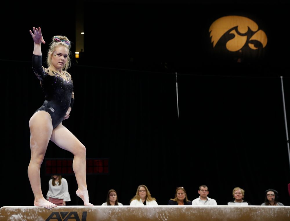 Iowa's Charlotte Sullivan competes on the beam