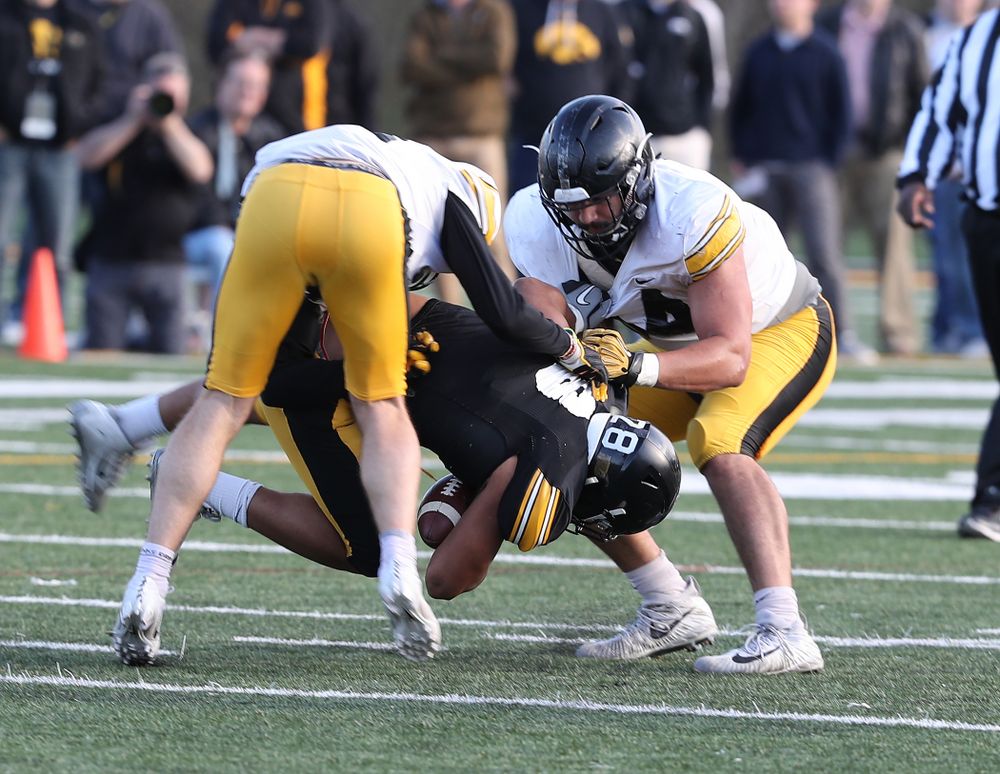 Iowa Hawkeyes running back Toren Young (28) and defensive end A.J. Epenesa (94) during the teamÕs final spring practice Friday, April 26, 2019 at the Kenyon Football Practice Facility. (Brian Ray/hawkeyesports.com)