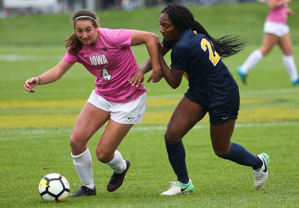 Iowa Hawkeyes forward Kaleigh Haus (4) dribbles the ball during a game against Michigan at the Iowa Soccer Complex on October 14, 2018. (Tork Mason/hawkeyesports.com)