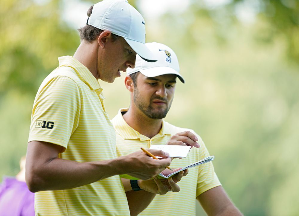 Iowa assistant coach Charlie Hoyle (from left) talks with Gonzalo Leal during the third day of the Golfweek Conference Challenge at the Cedar Rapids Country Club in Cedar Rapids on Tuesday, Sep 17, 2019. (Stephen Mally/hawkeyesports.com)