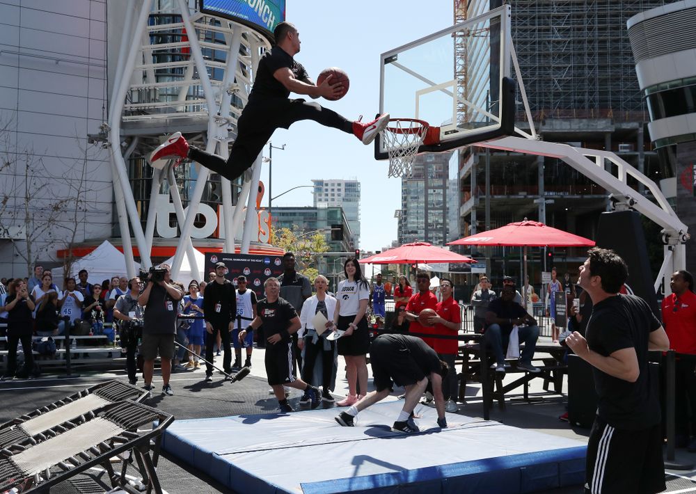 Iowa Hawkeyes forward Megan Gustafson (10) judges dunks with DukeÕs Zion Williamson  during a Special Olympics event Friday, April 12, 2019 as part of the ESPN College Basketball Awards in the XBOX Plaza at LA Live.  (Brian Ray/hawkeyesports.com)