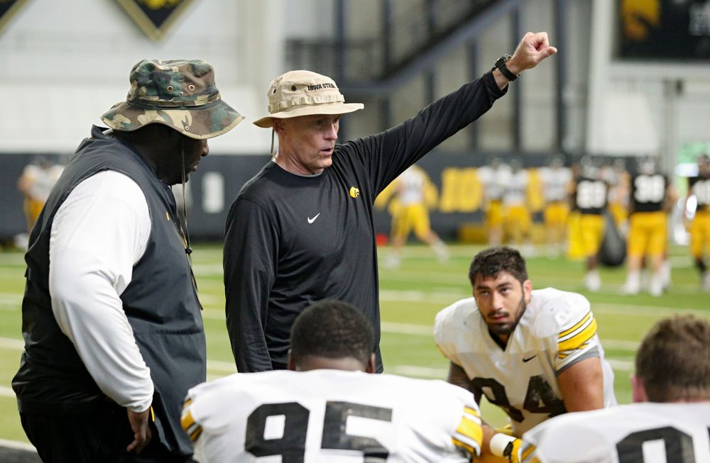 Iowa Hawkeyes assistant defensive line coach Jay Niemann (center) talks as defensive line coach Kelvin Bell (left) looks on during Fall Camp Practice No. 6 at the Hansen Football Performance Center in Iowa City on Thursday, Aug 8, 2019. (Stephen Mally/hawkeyesports.com)