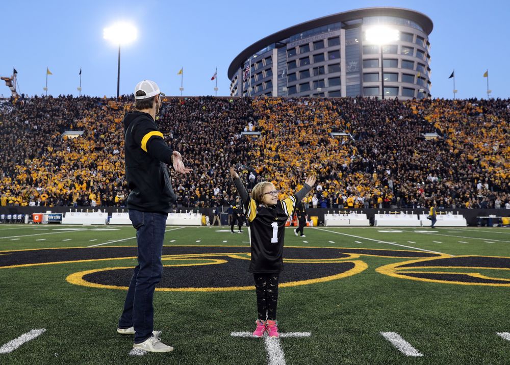 Honorary Captain Ricky Stanzi and Stead Family ChildrenÕs Hospital Kid Captain Gabby Yoder before the Iowa Hawkeyes game against the Penn State Nittany Lions Saturday, October 12, 2019 at Kinnick Stadium. (Brian Ray/hawkeyesports.com)