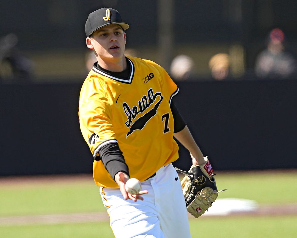 Iowa Hawkeyes pitcher Grant Judkins (7) tosses the ball to first base for an out during the fourth inning against Illinois at Duane Banks Field in Iowa City on Sunday, Mar. 31, 2019. (Stephen Mally/hawkeyesports.com)